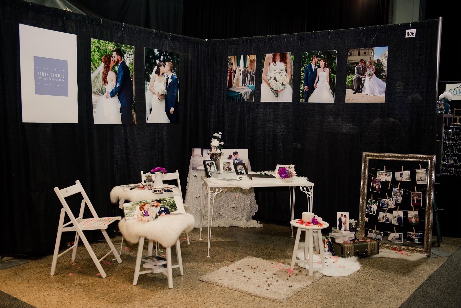 A room with a table and chairs and pictures on the wall