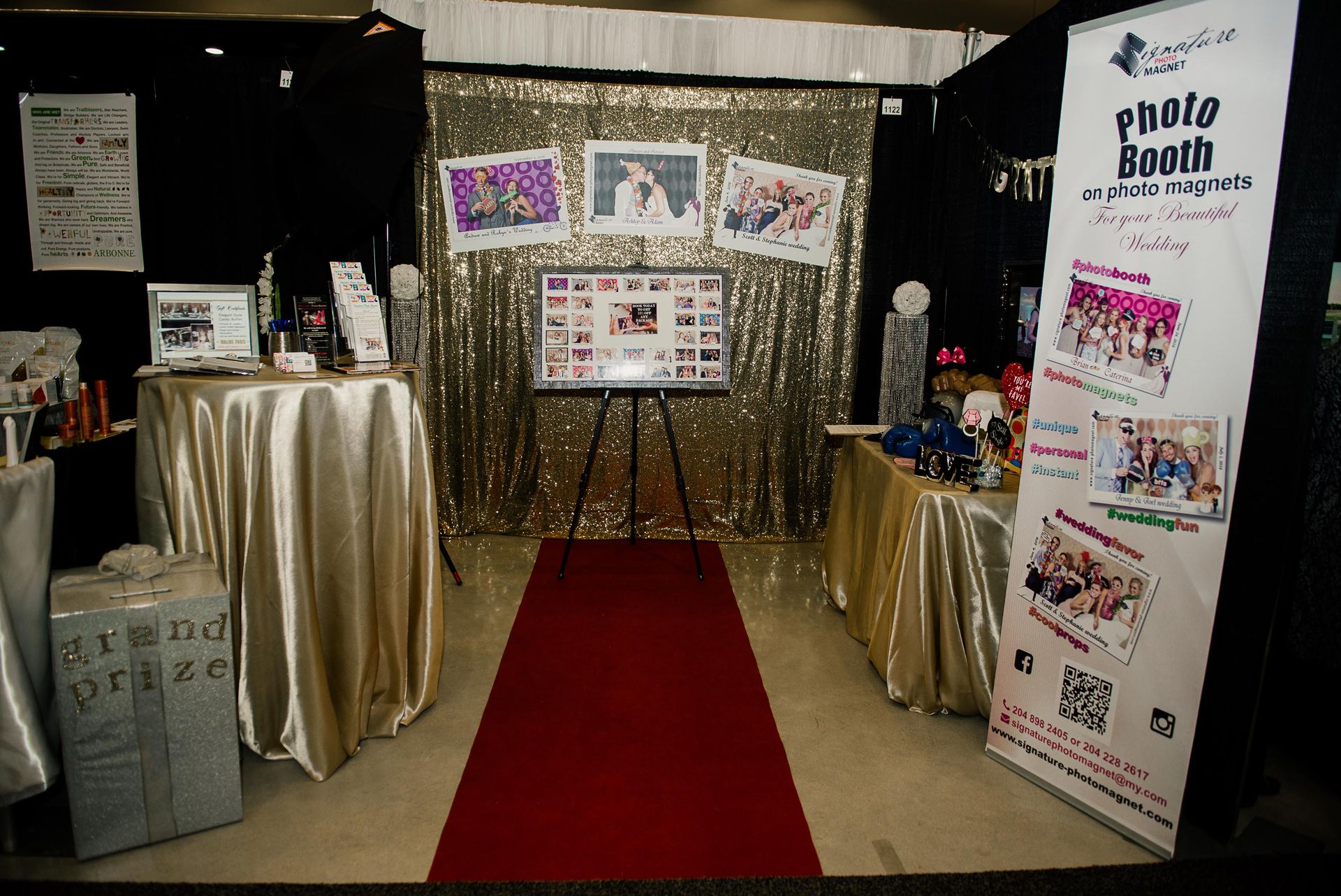 A photo booth with a red carpet and a sign that says photo booth