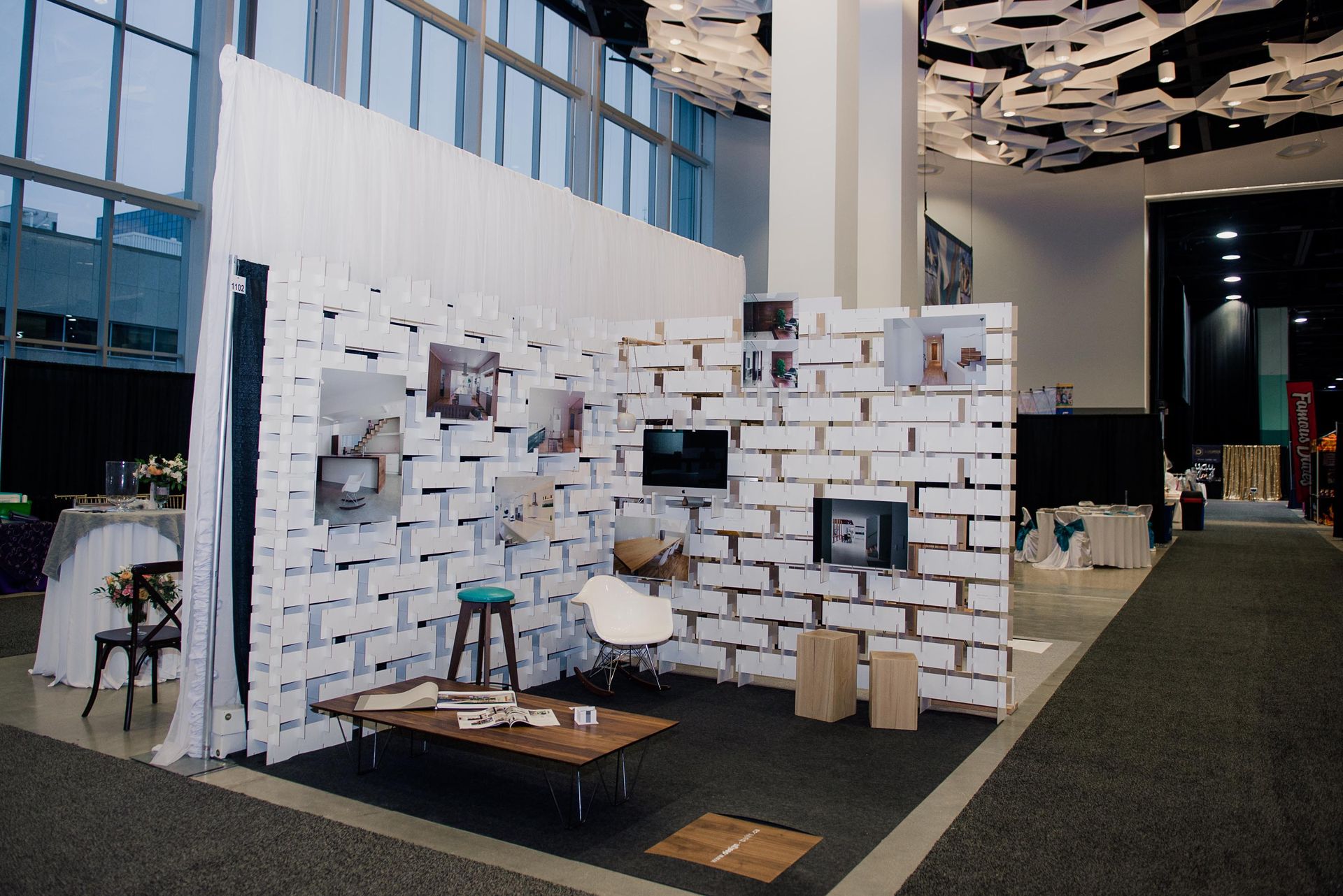 A brick wall with a table and chairs in front of it