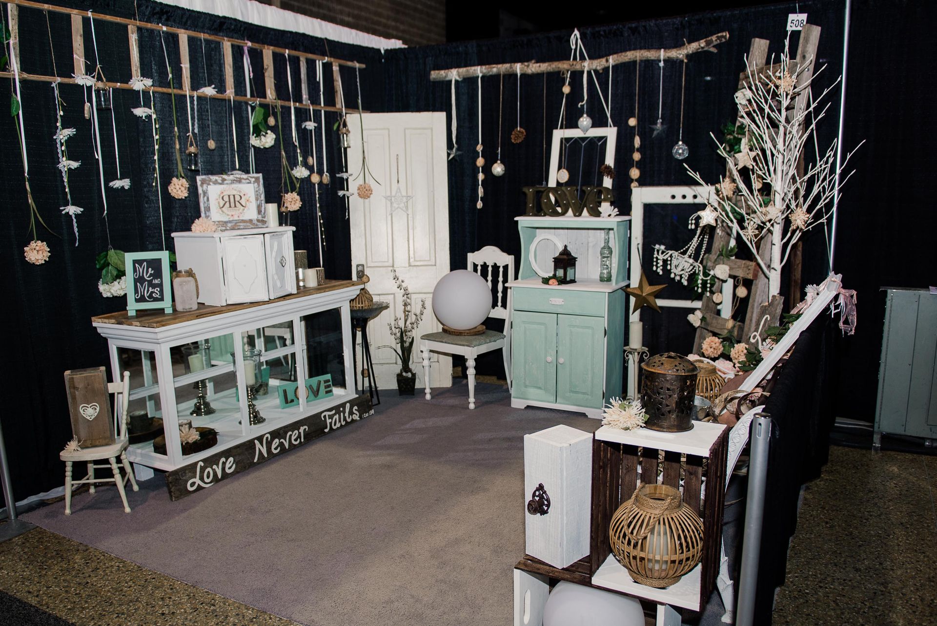 A room with furniture and a sign that says love never fails