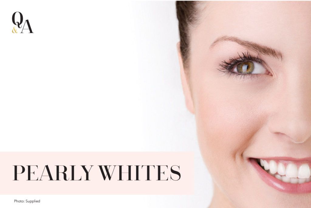 A close up of a woman 's face with the words pearly whites on the bottom
