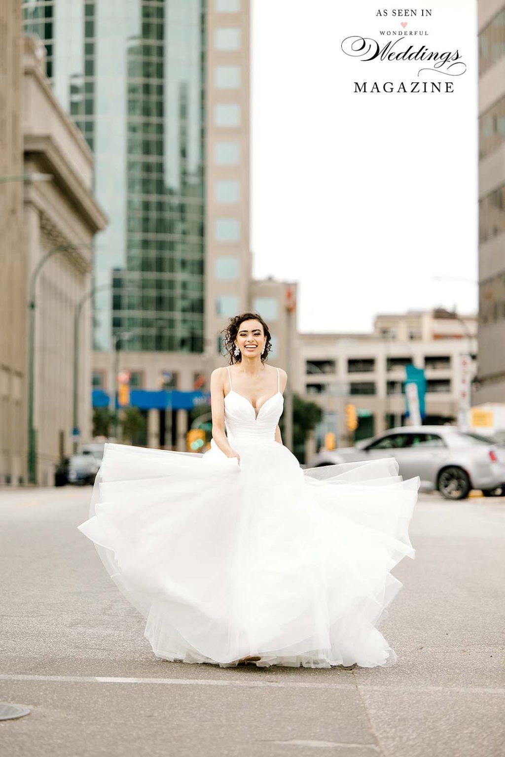 A bride in a wedding dress is walking down a city street.