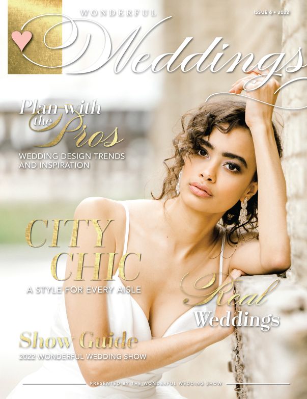A woman in a wedding dress is on the cover of a wedding magazine.