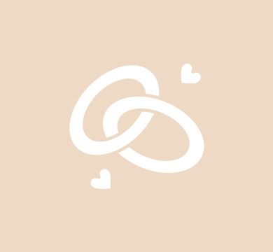 A pair of wedding rings with hearts around them on a beige background.