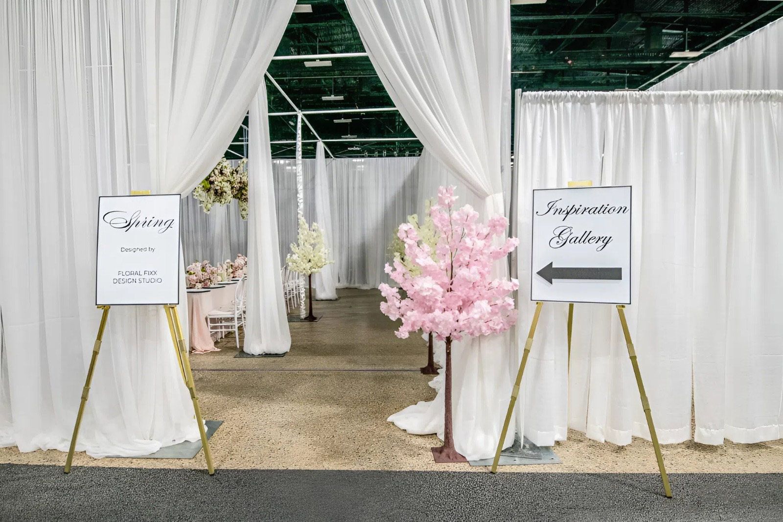 There is a pink cherry blossom tree in the middle of the room.