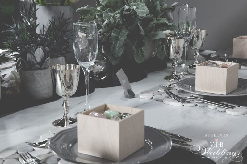 A table set for a wedding with plates and glasses