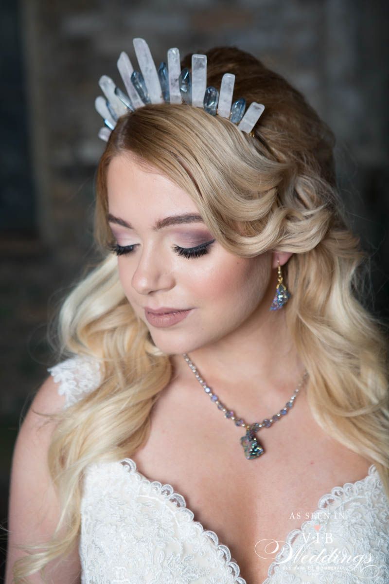 The bride is wearing a tiara and a necklace.