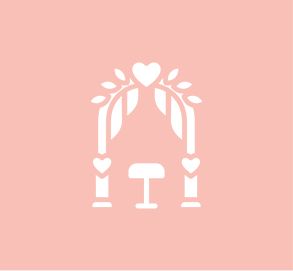 A white icon of a wedding arch with hearts and leaves on a pink background.