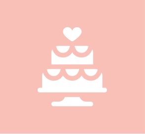 A white cake with a heart on top of it on a pink background.