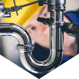 Plumber Fixing a Drain — Rockford, IL — ProTech Plumbing Heating & Cooling Plumber Fixing a Drain — Rockford, IL — ProTech Plumbing Heating & Cooling