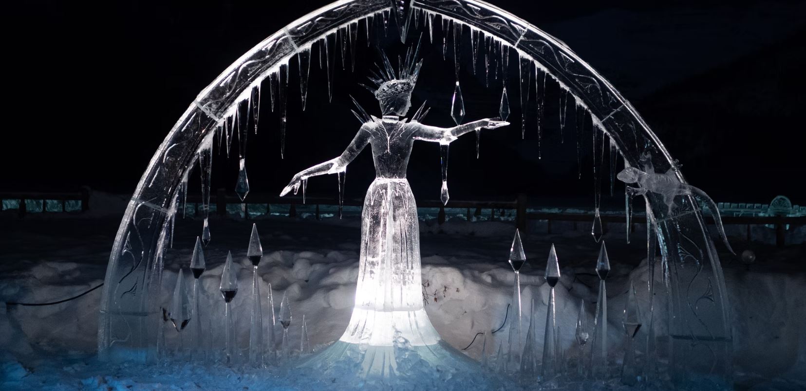 A fountain with a statue of a woman in the middle of it.