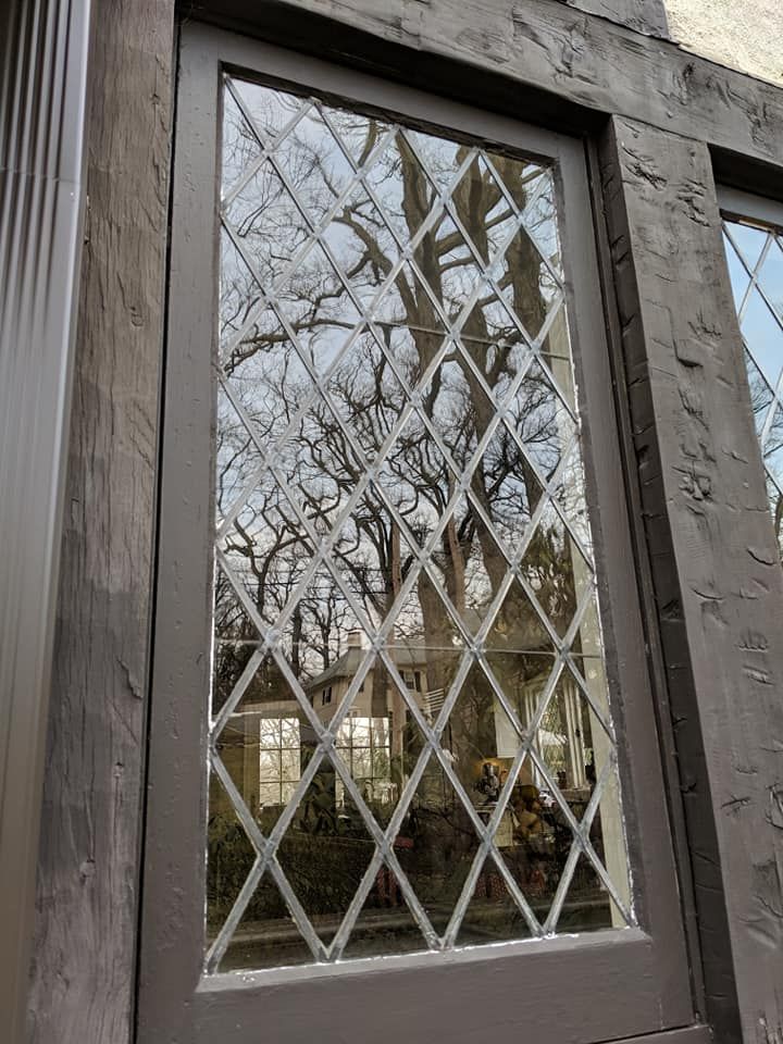 A close up of a stained glass window on a building.