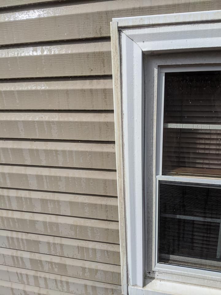 A close up of a window on the side of a house