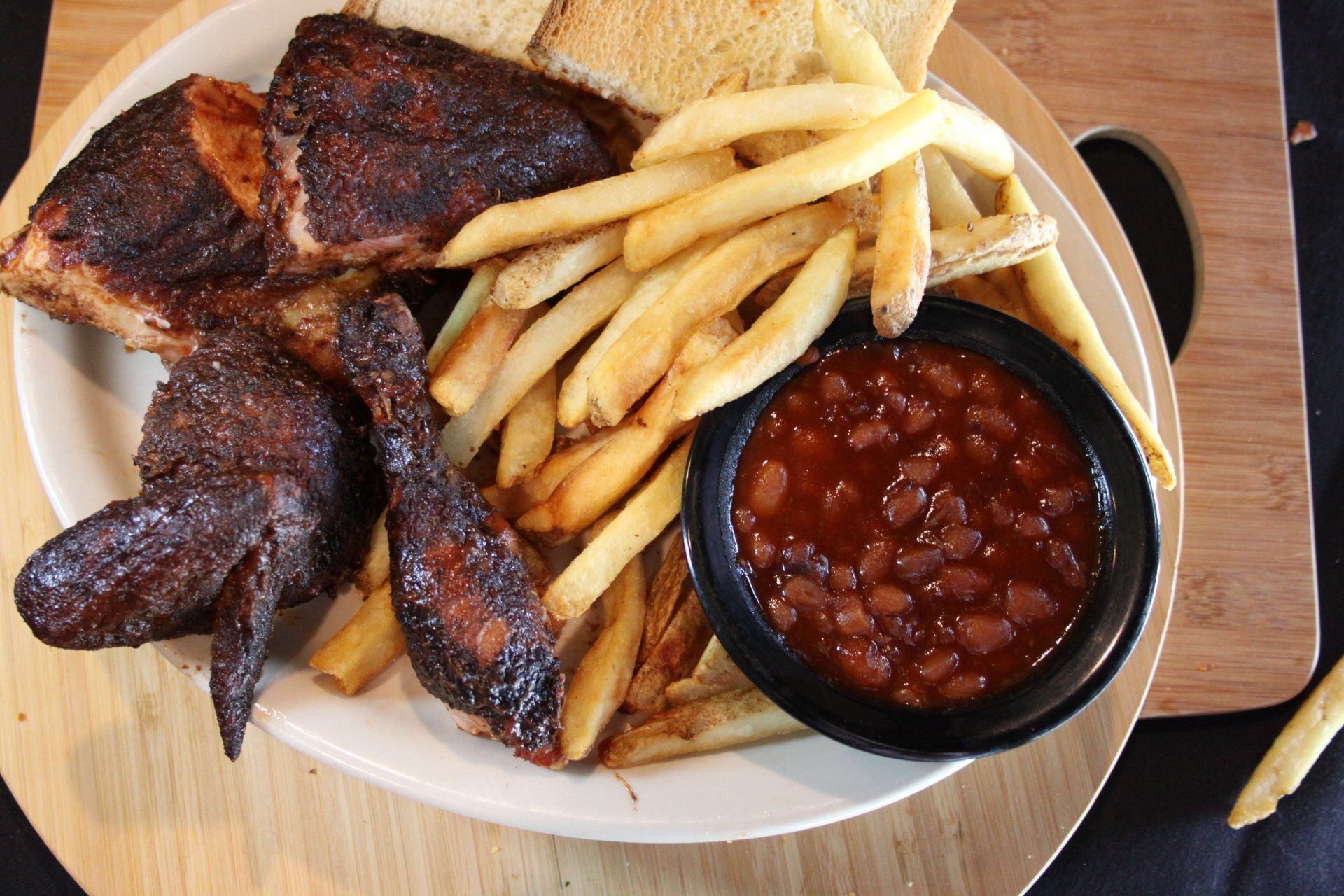 Chicken wings french fries and baked beans at Kansas City