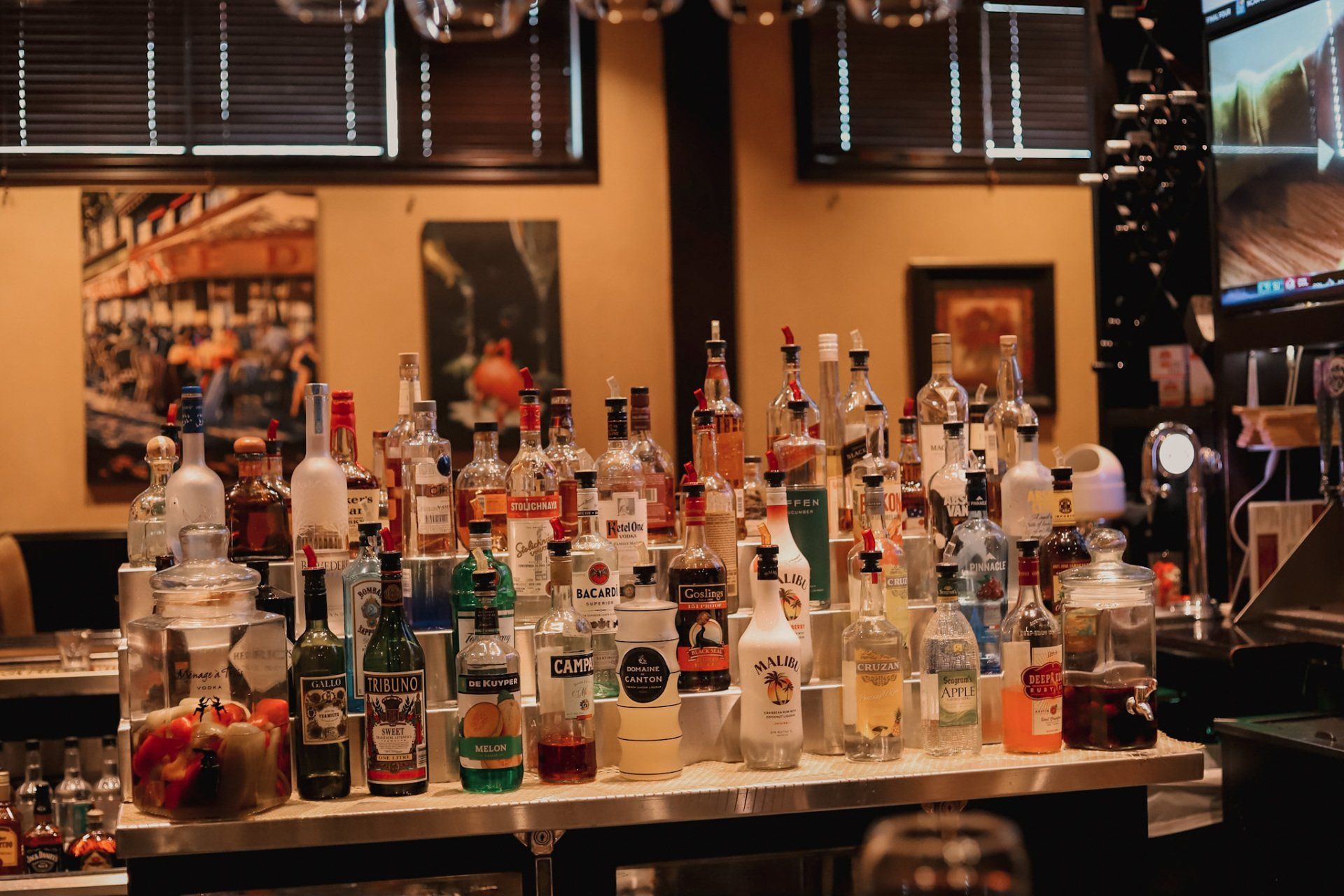 Cocktail mixer being poured into a drink, enhancing flavor and refreshment