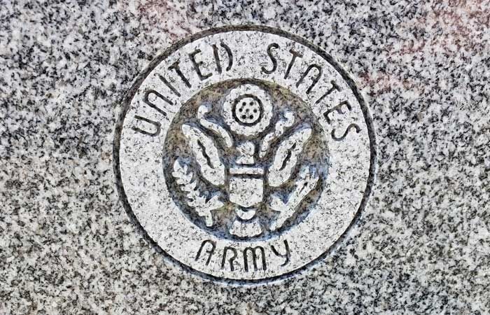United States Army seal engraved on a speckled stone surface