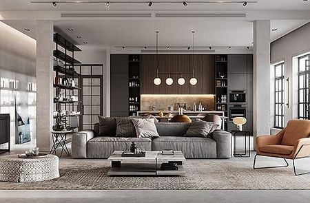 Modern open-plan living room with gray sectional, coffee table, pendant lights, and built-in shelves