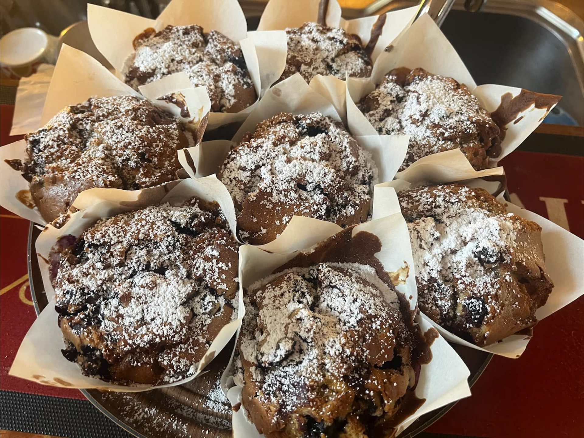 Chocolate Muffins Dusted With Powdered Sugar, Arranged on a Decorative Plate — 321 Cafe Learmonth In Learmonth, VIC