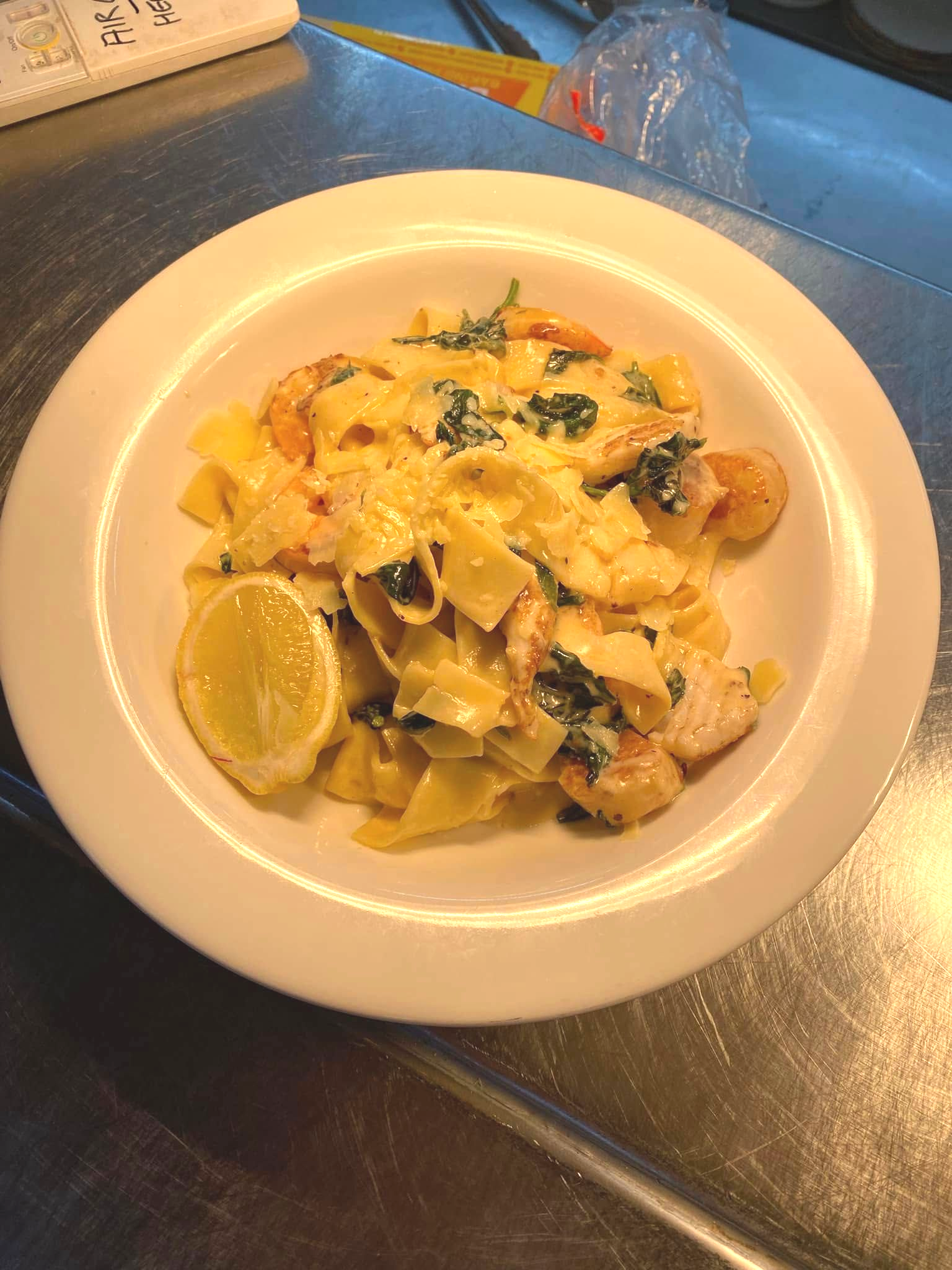 Pasta Dish With Shrimp, Spinach, and a Lemon Slice — 321 Cafe Learmonth In Learmonth, VIC