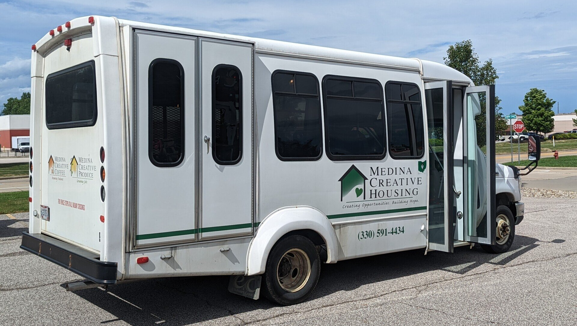 Helping Man On Wheelchair — Medina, OH — Medina Creative Housing Helping Man On Wheelchair — Medina, OH — Medina Creative Housing