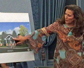 Woman Pointing To The Image — Medina, OH — Medina Creative Housing Woman Pointing To The Image — Medina, OH — Medina Creative Housing