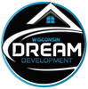 Logo for Wisconsin Dream Development: a circular emblem with a house outline, a blue window, and white and blue text.