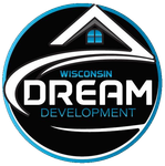 Logo for Wisconsin Dream Development: a circular emblem with a house outline, a blue window, and white and blue text.