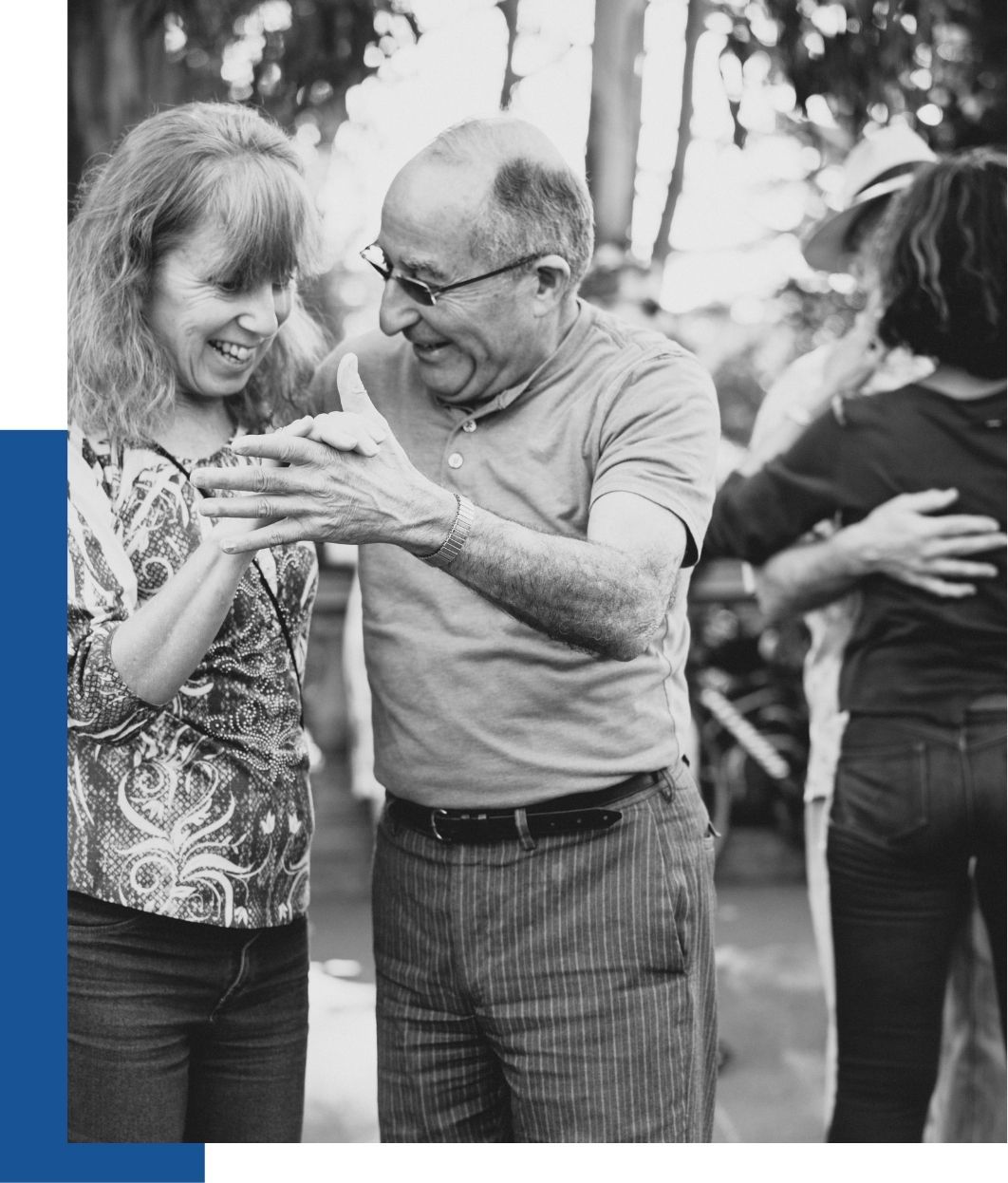 A man and woman dancing outdoors at a loved one's celebration of life