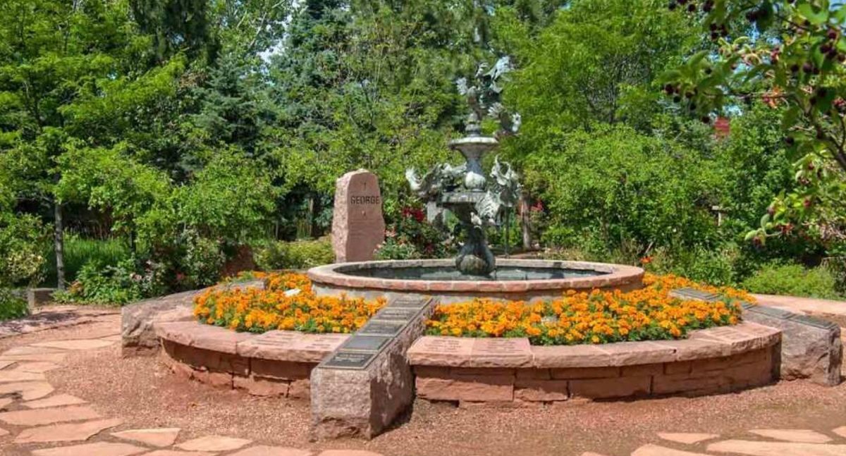Circular fountain garden with seasonal flowers