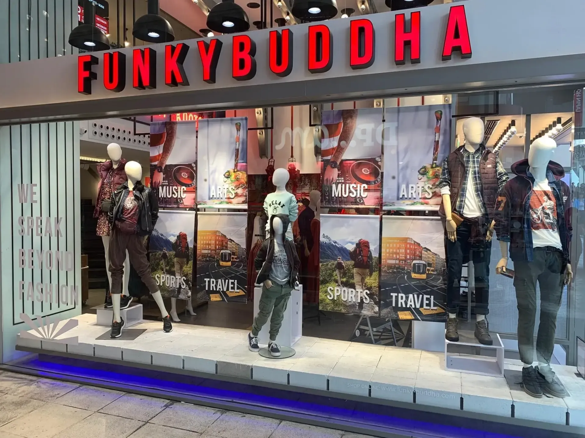 Funky Buddha storefront with mannequins displaying clothing; red logo on top.