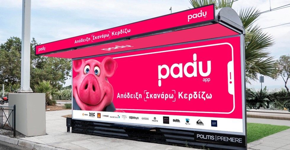Bus shelter advertisement for Padu app with a pink pig, using a pink and white color scheme.