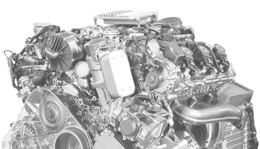 Grayscale close-up of a high-performance car engine with visible belts, hoses, and intake components | Mario’s Automotive