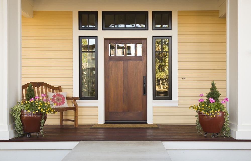 Yellow House Front With Wood Door, Dark-framed Windows — Working Windows in Mullumbimby, NSW