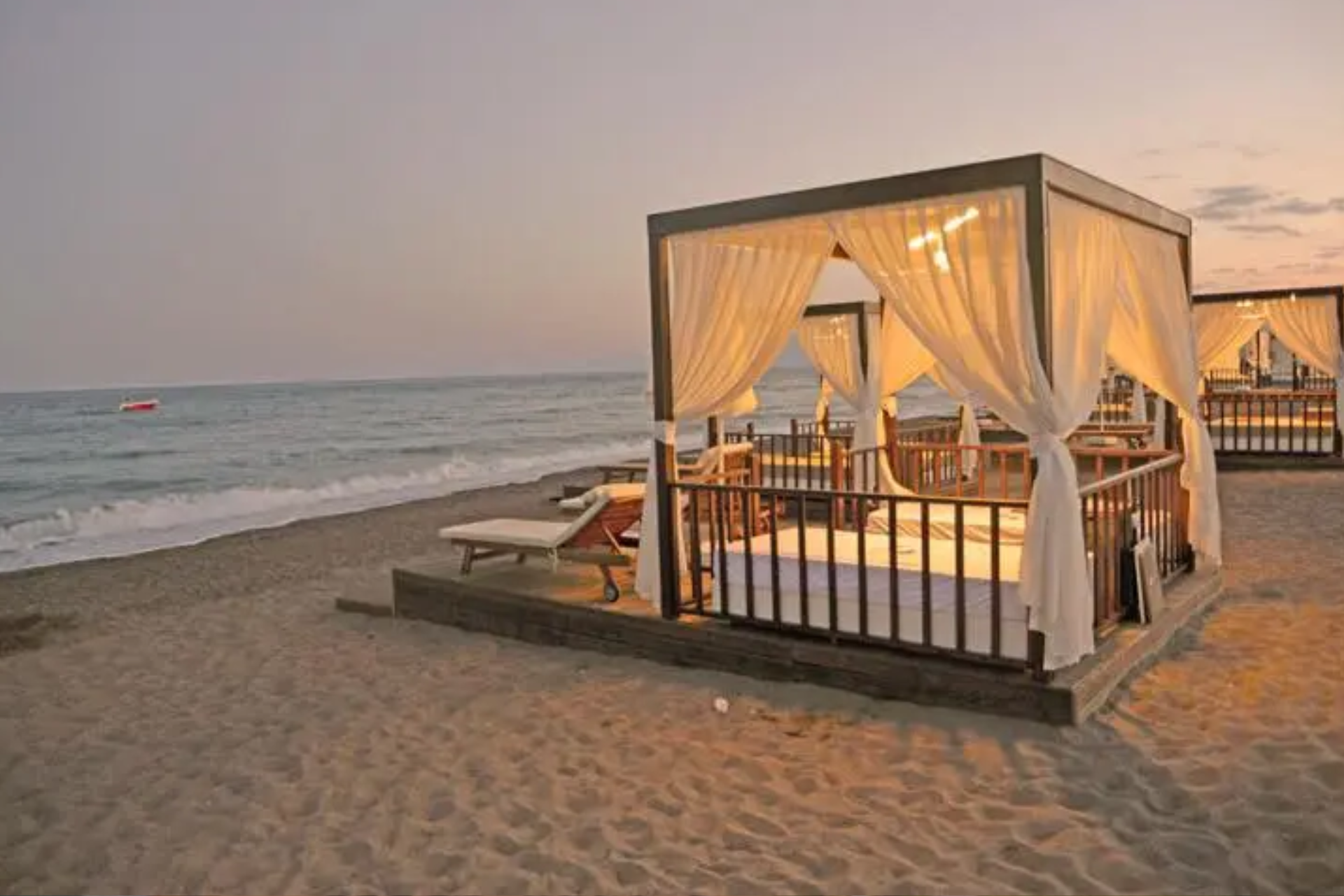 There are a lot of canopies on the beach.