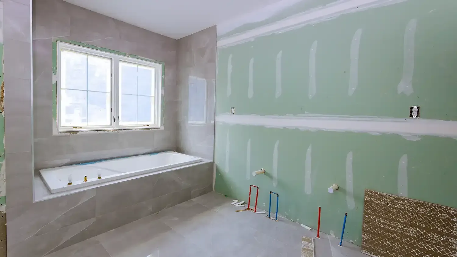 Under construction new bathtub remodeling a home bathroom, plumbing pipe for new sinks