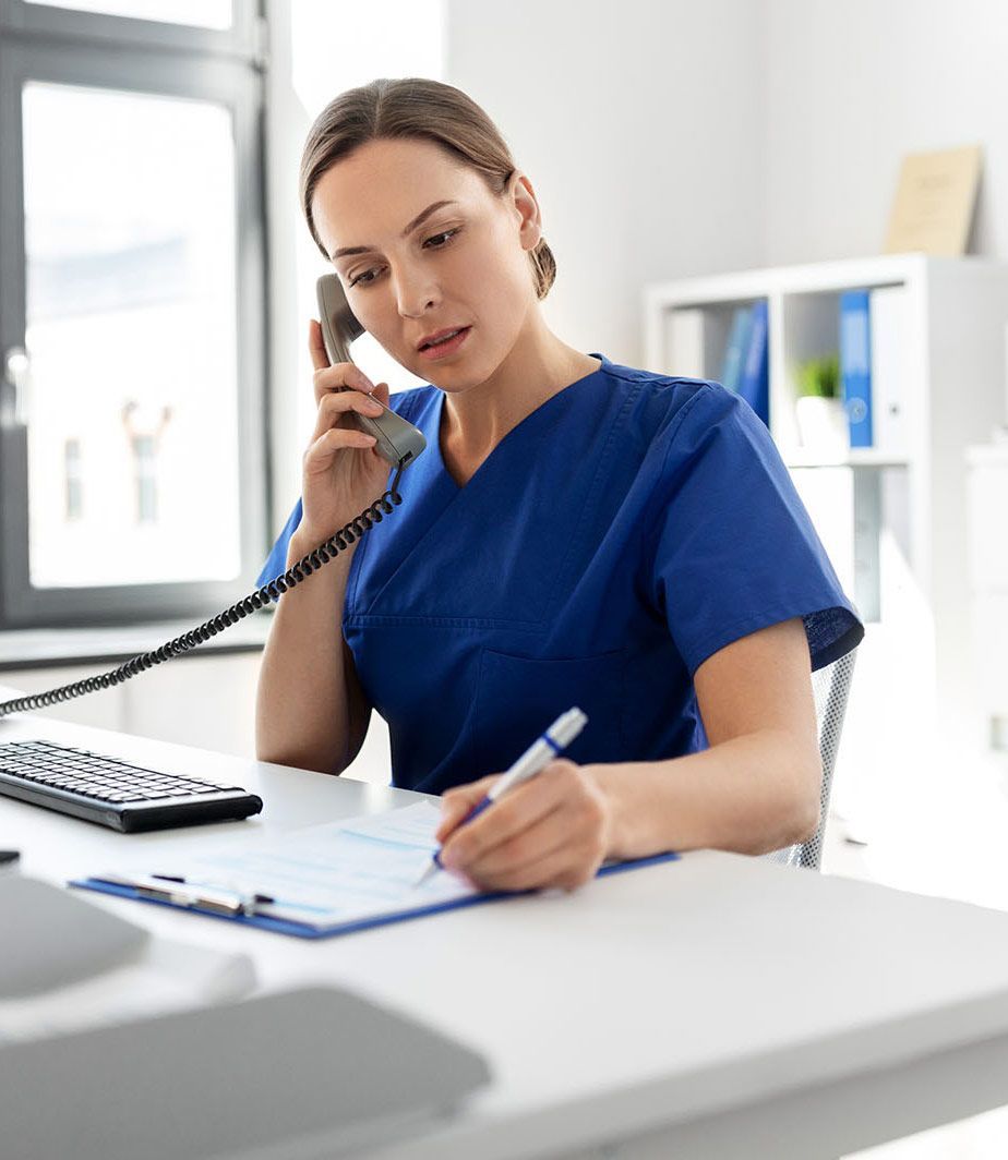 RN helping patient via telephone