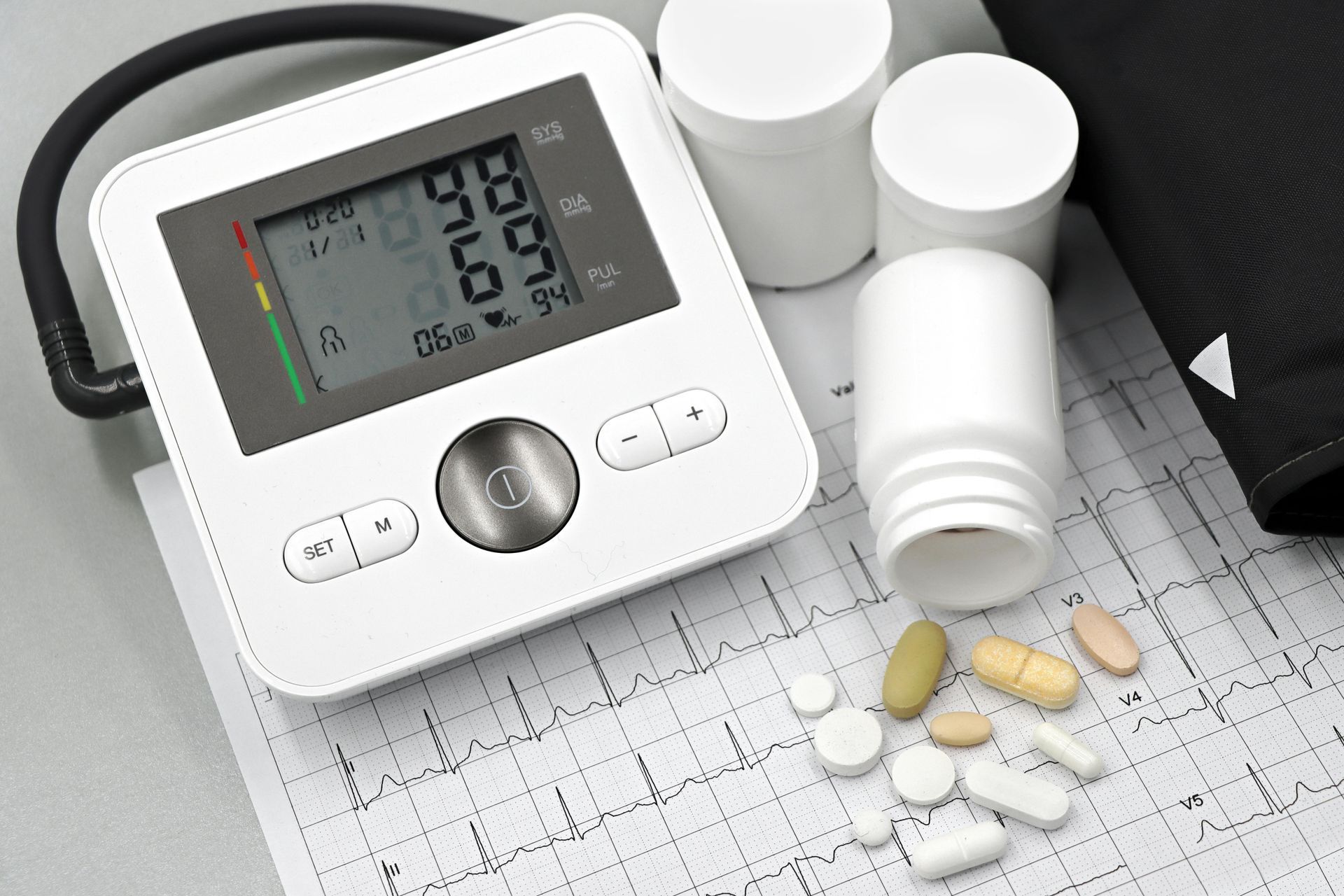 Patient measuring blood pressure at home with nurse instructions