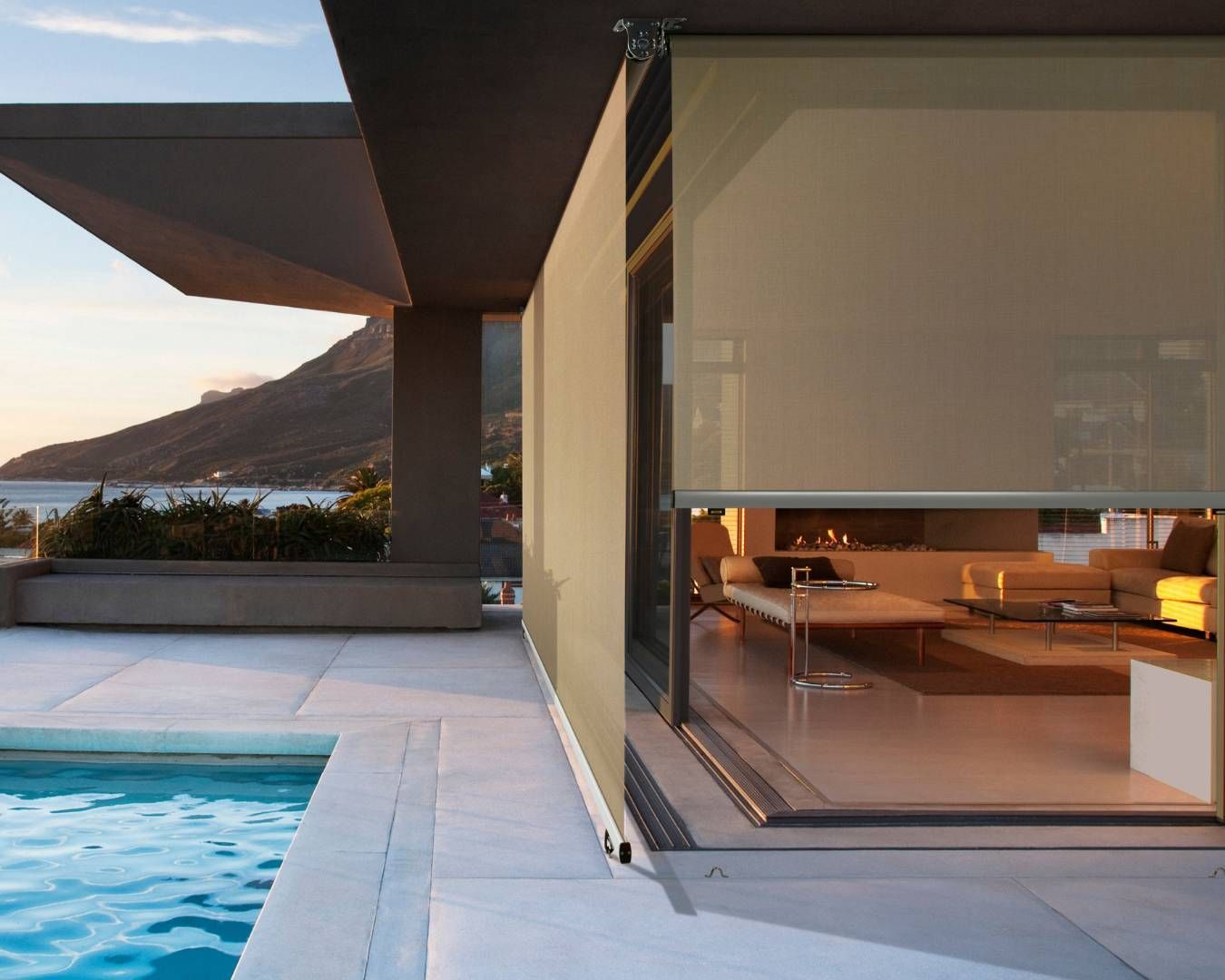 A house with a swimming pool in front of it
