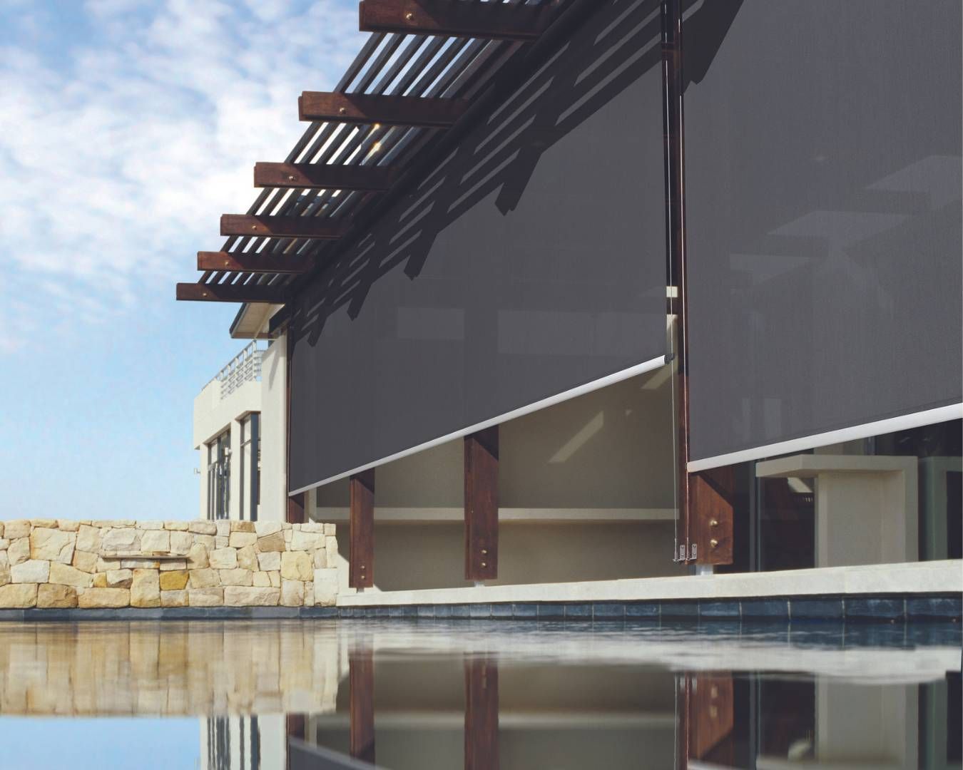 A building with a swimming pool in front of it