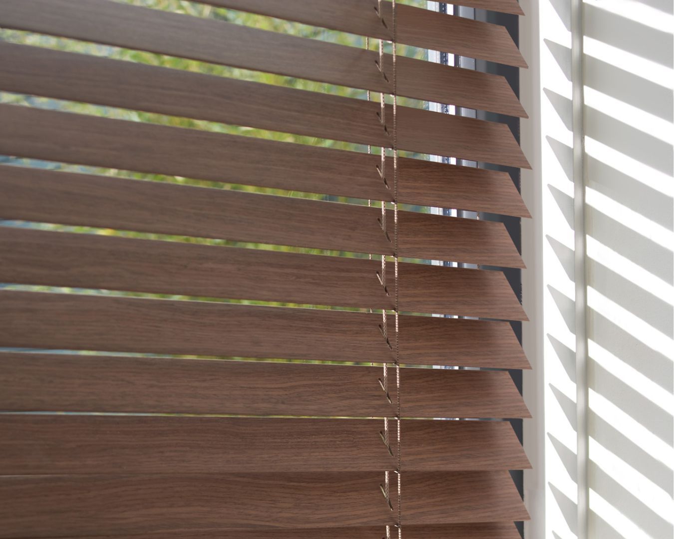A close up of a wooden blind on a window