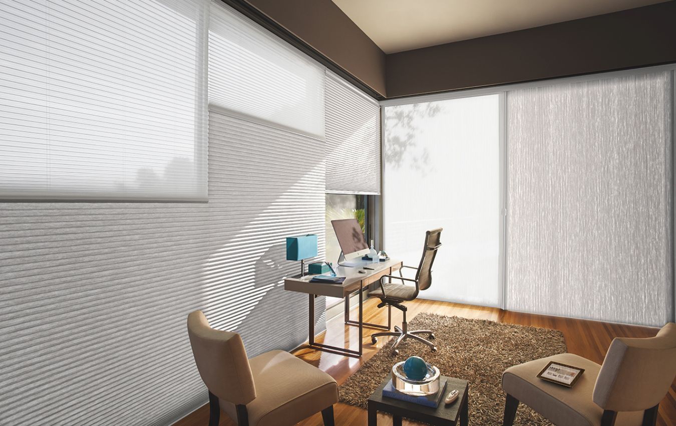 A living room with a table and chairs and window blinds