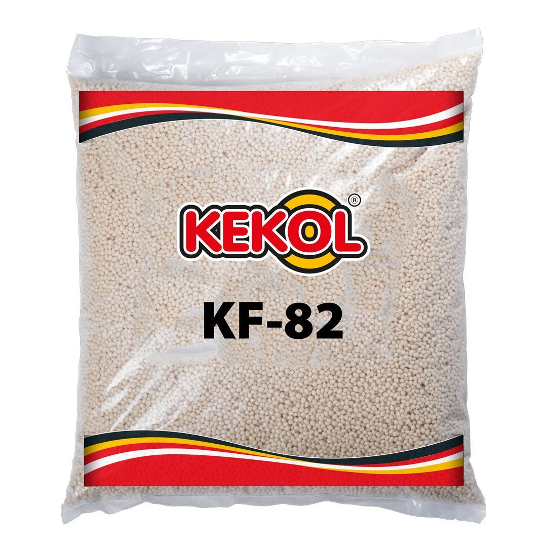 Bolsa de gránulos blancos KEKOL KF-82 con bandas rojas, amarillas y negras.