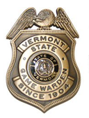 Vermont State Game Warden badge, gold-tone metal with an eagle crest and state seal.