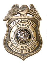 Vermont State Game Warden badge, gold-tone metal with an eagle crest and state seal.