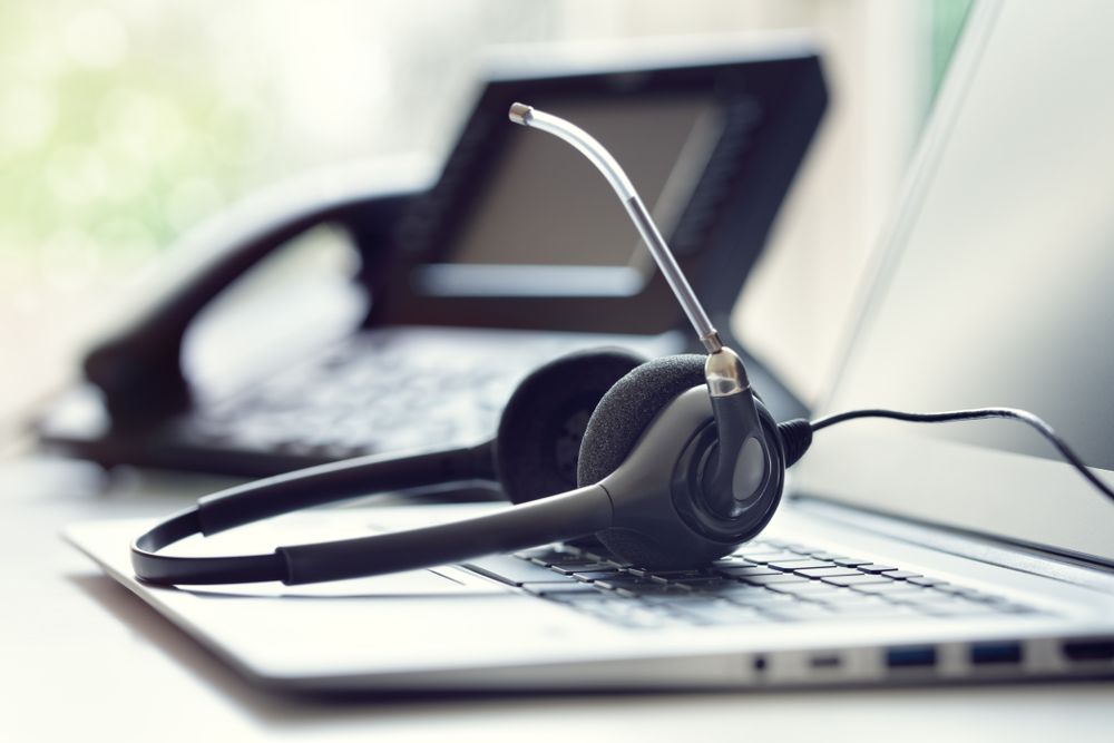 A Headset Is Sitting On Top Of A Laptop Computer — D-stress Computers In Idalia, QLD