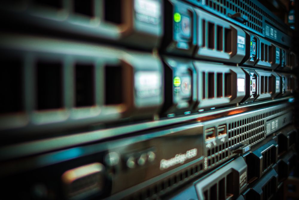 A Man Is Working On A Server In A Server Room — D-stress Computers In Idalia, QLD