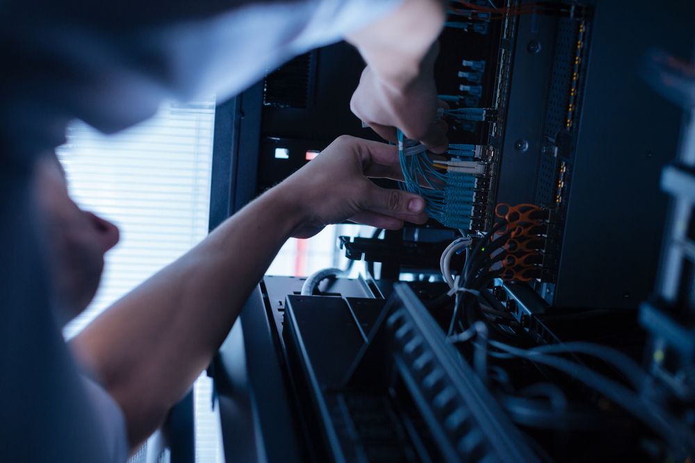 A Man Is Working On A Server In A Data Center — D-stress Computers In Idalia, QLD