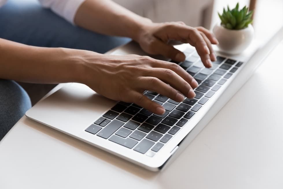 A Person Is Typing On A Laptop Computer — D-stress Computers In Idalia, QLD