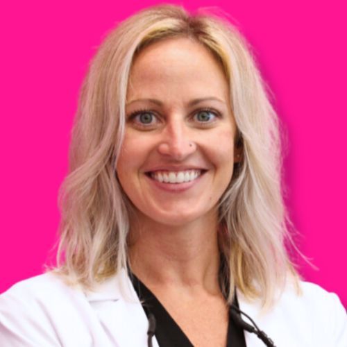 A person with blonde hair wearing a white lab coat over a black shirt against a bright pink background.