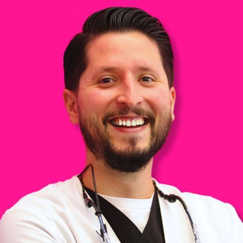 A smiling person wearing a white medical scrub top and black undershirt, set against a solid hot-pink background.